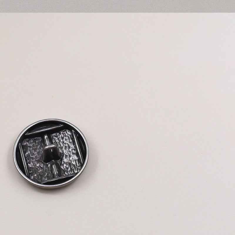 Silver metal shank button back, concave interior with mounting post