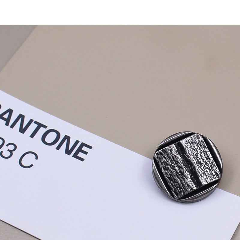 Vintage silver metal shank button with concave textured surface
