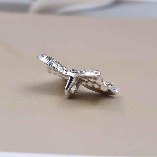 Silver rhinestone bow shank button, side view showing metal post