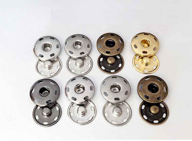 Mixed snap buttons in silver, bronze, and gold tones with round 4-hole faces