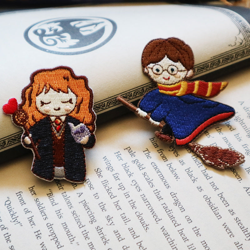 Self-adhesive embroidered patches: curly-haired witch holding wand and scarf boy