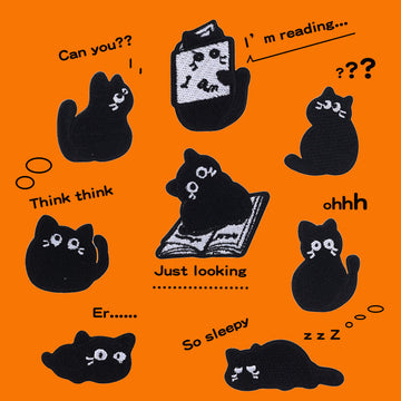 Set of 10 embroidered black cat patches with small white faces and paws