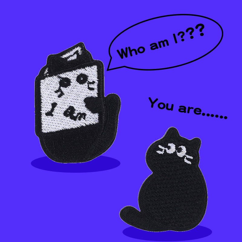 Two embroidered black cat patches: one standing upright, one sitting, with white eyes