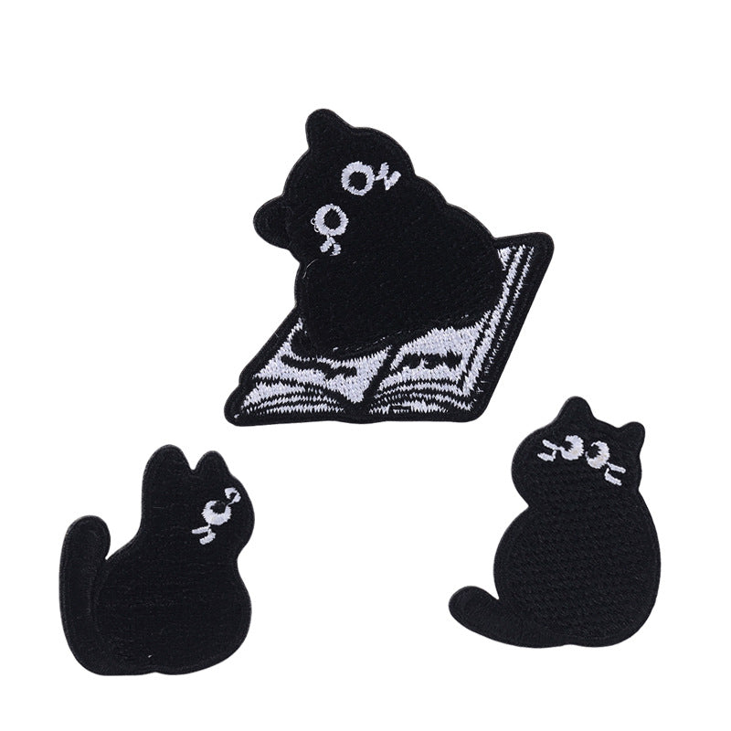 Black cat lying patch with white face and belly, 22mm x 28mm