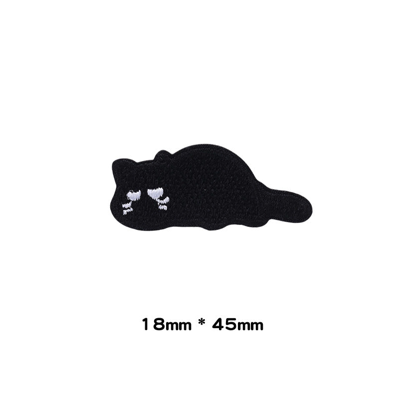 Schwarzer liegender Katzenpatch mit weißen Pfoten, selbstklebend, 18×45 mm