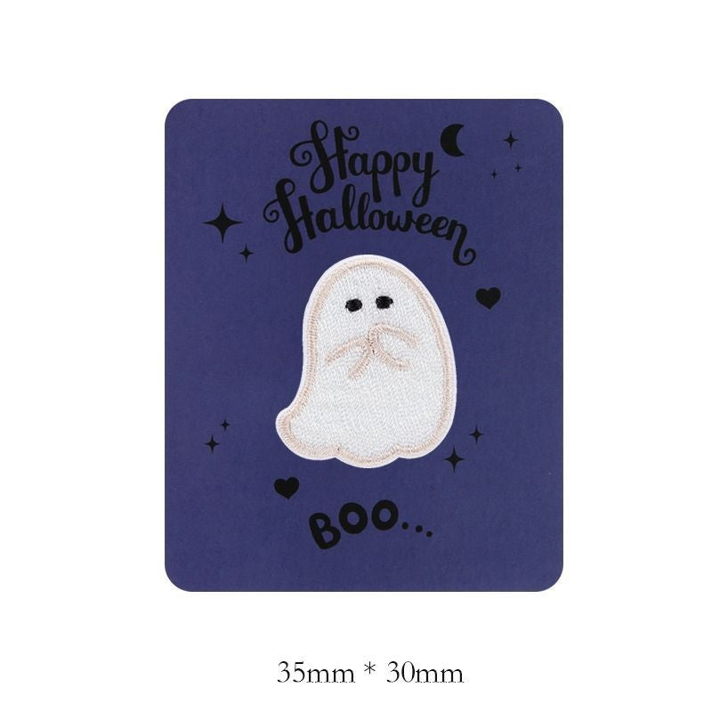 White embroidered ghost patch with small black eyes and mouth