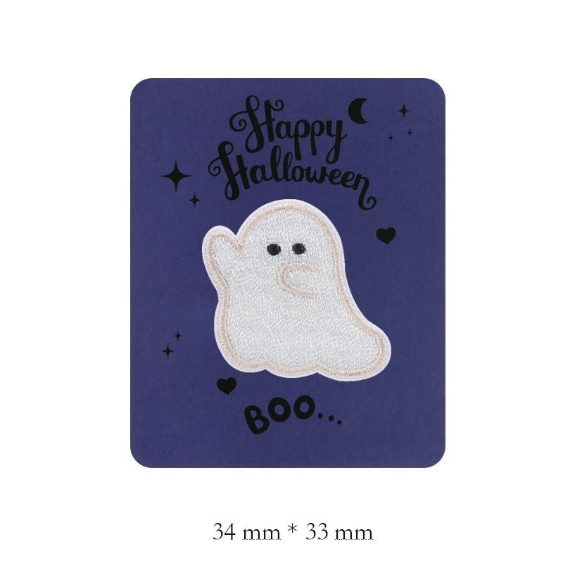 White embroidered ghost patch with small black eyes and raised hand