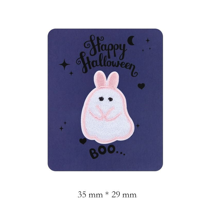Pink-and-white embroidered bunny ghost patch with upright ears and smiling face
