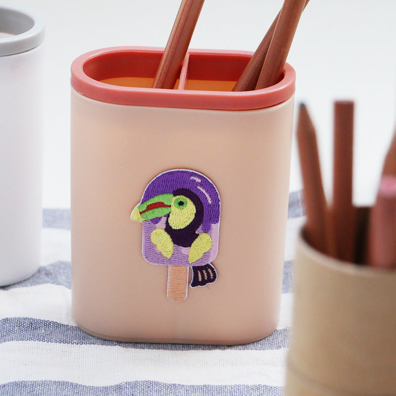 Purple bird ice-pop embroidered patch on container, self-adhesive back and stick handle
