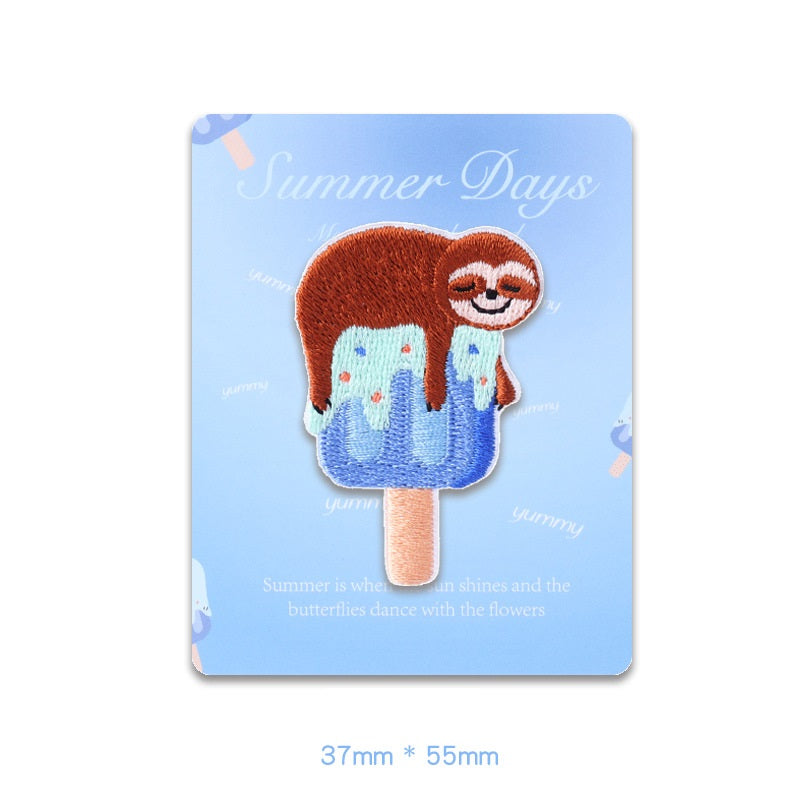 Brown and blue sloth ice-pop embroidered patch on card, self-adhesive with stick handle