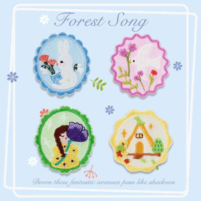 Four Forest Song embroidered adhesive patches: rabbit, bird, flowers, cabin scene