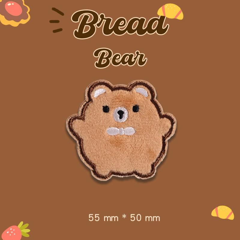 Tan plush bear embroidered patch with centered face, 55 mm x 50 mm
