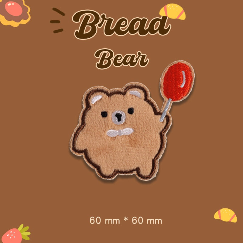 Plush bread bear embroidered patch with stitched face and red heart, 60x60 mm