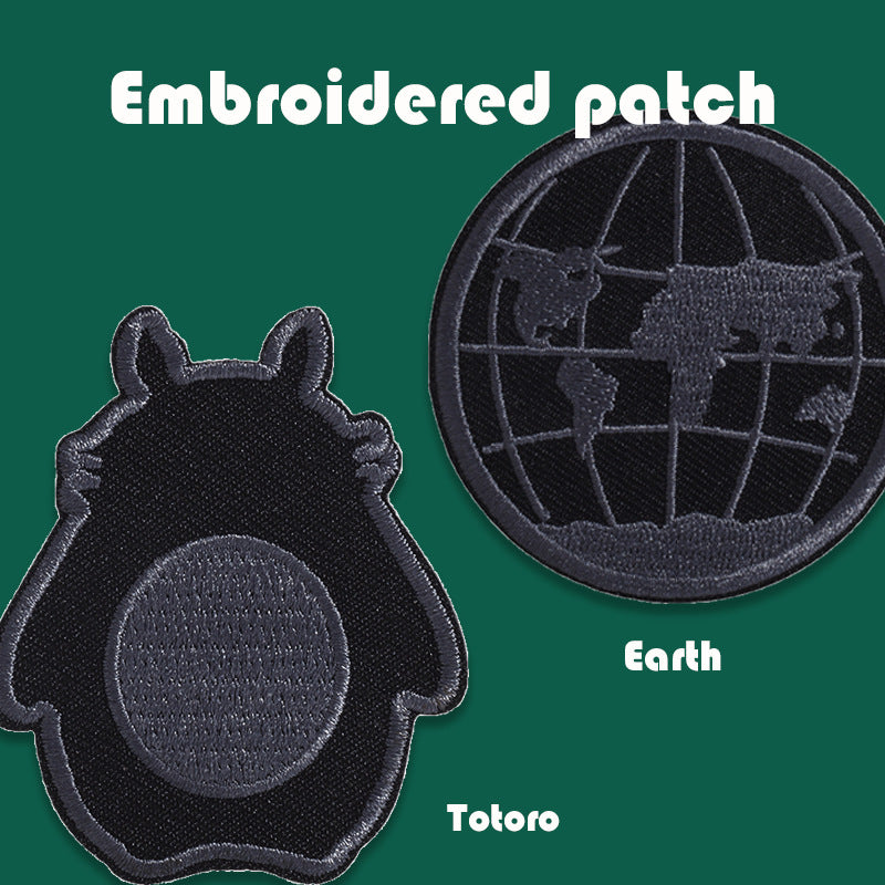 Black embroidered badge patches featuring Totoro cat and Earth globe circular design