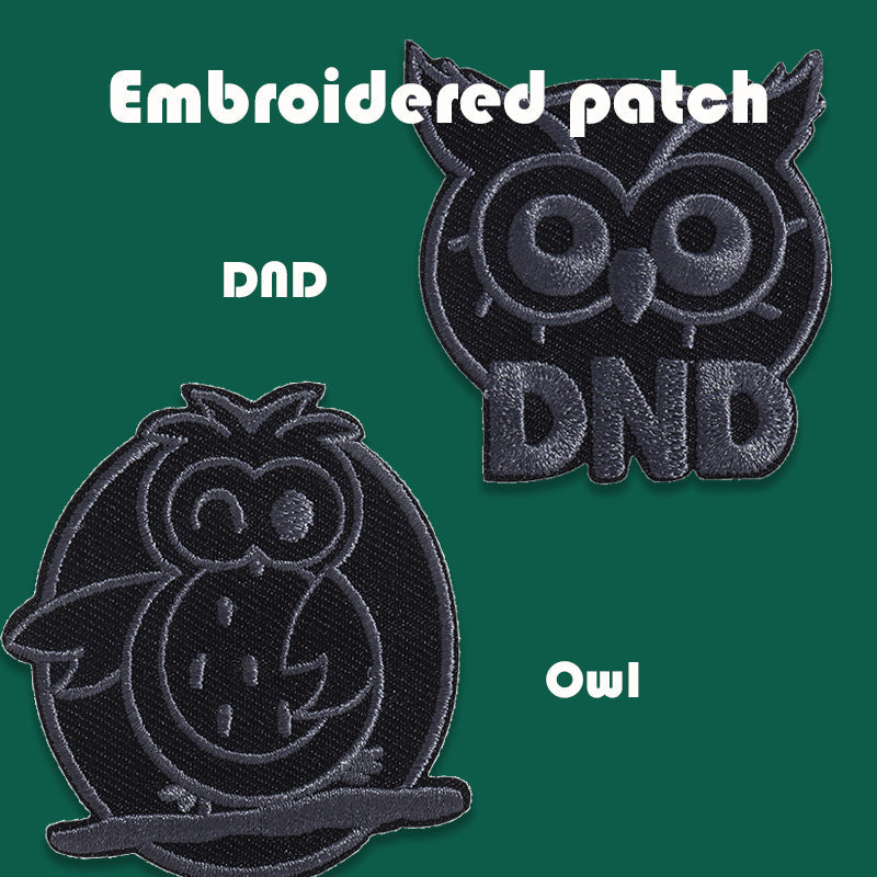 Black embroidered badge patches showing DnD owl and Totoro cat face designs