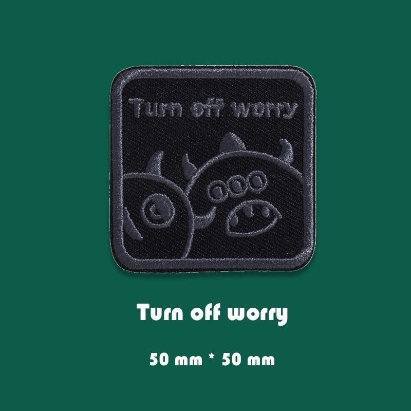 Black embroidered badge patch with “Turn off worry” design, 50mm x 50mm