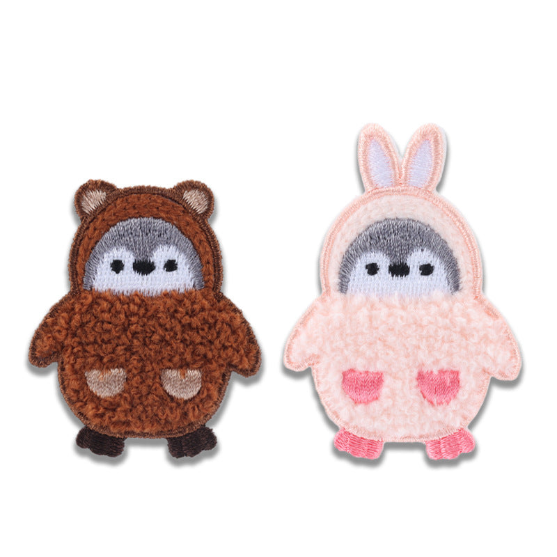 2er Set Flauschen-Pinguin-Patches: braun und rosa, je mit grauem Gesicht