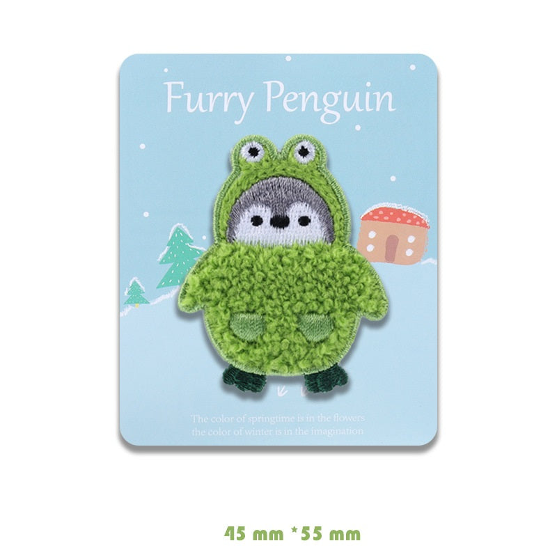 Grüner Flauschen-Pinguin-Patch mit grauem Gesicht, auf Karte