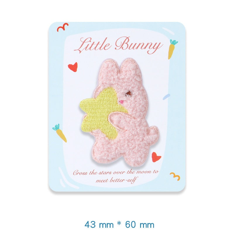 Pink plush bunny embroidered adhesive patch, hugging a yellow star