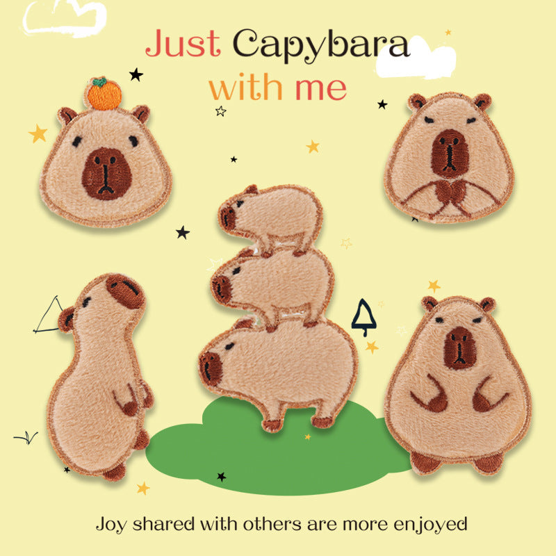 Self-adhesive capybara embroidered patch, sitting face forward, brown and tan.
