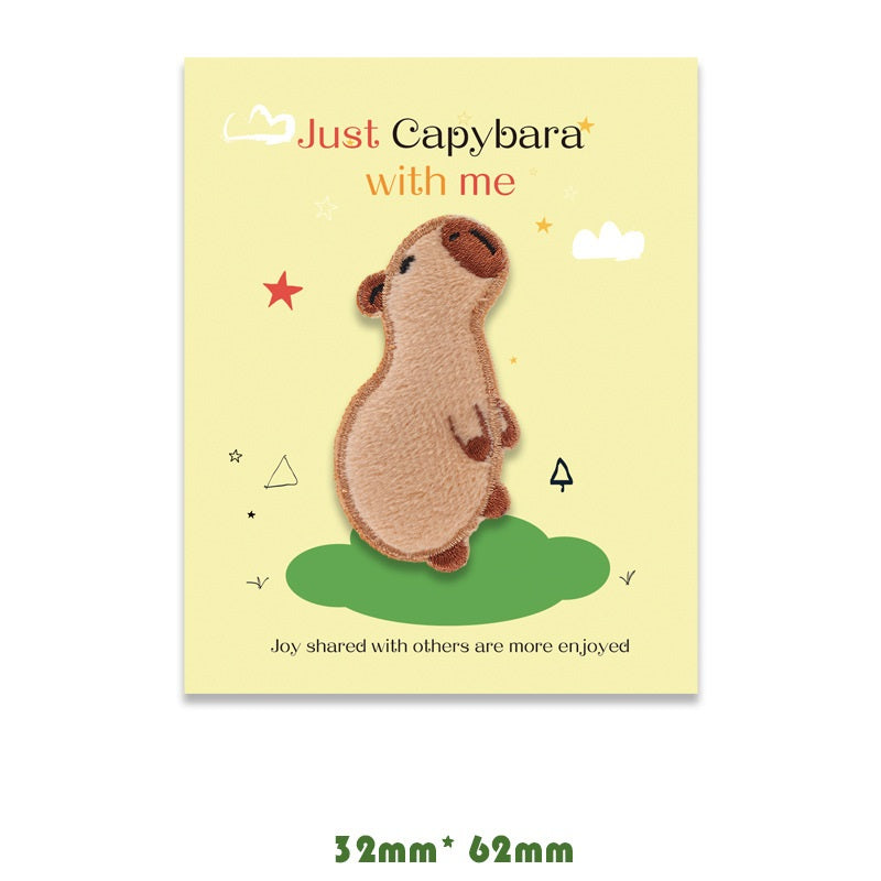 Brown capybara embroidered self-adhesive patch, side profile standing pose.