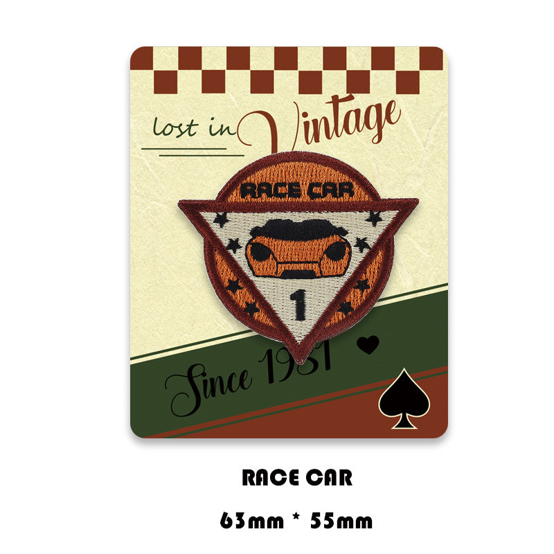 Race car embroidered triangle patch with car graphic and number '1' center.