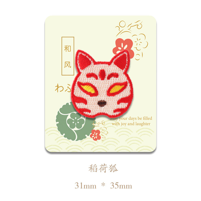 Red fox-face embroidered patch with pointed ears and smile; 31mm x 35mm