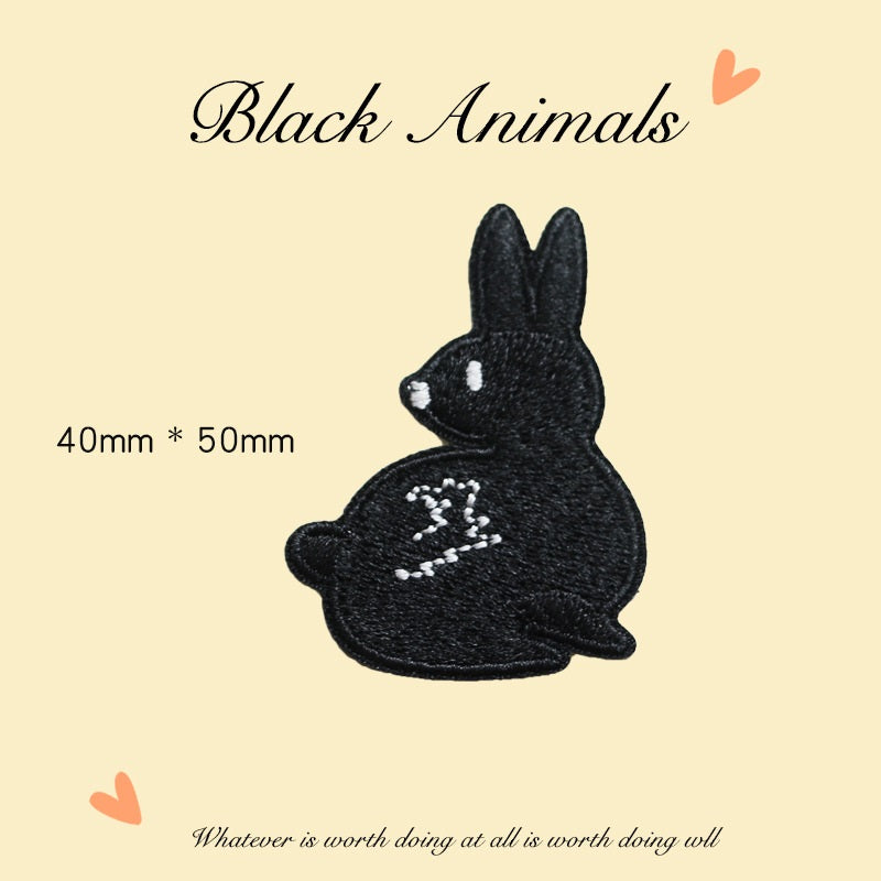 Black embroidered rabbit patch, white details, 40×50 mm