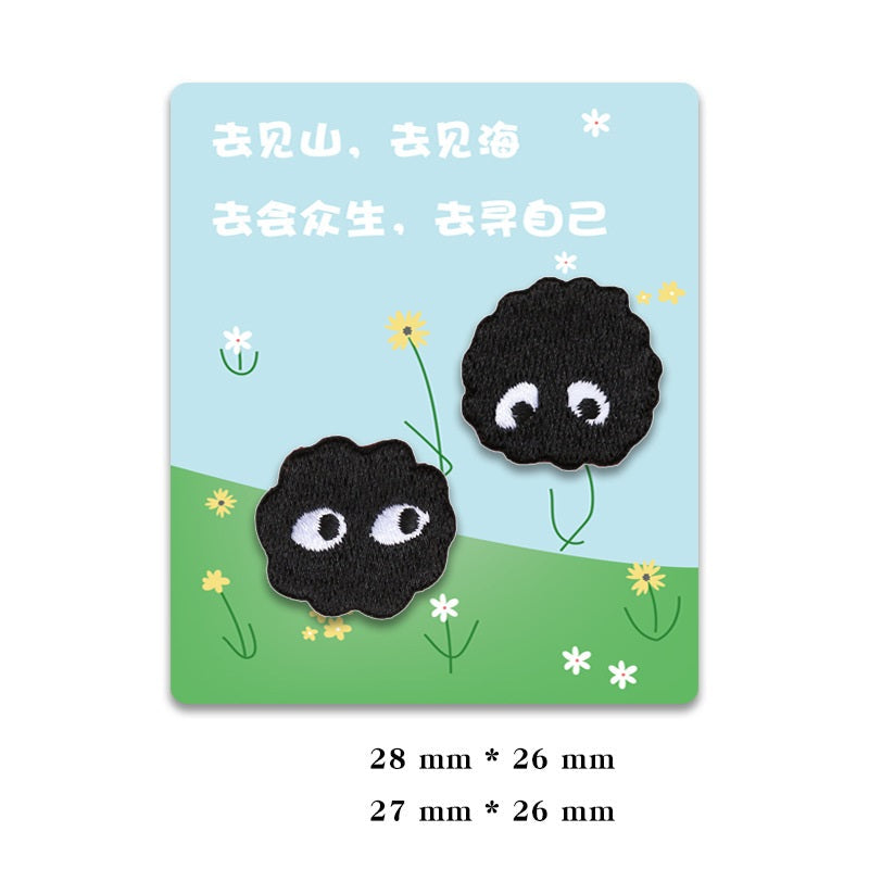 Two black self-adhesive coal ball elf patches with white-eyed embroidered faces
