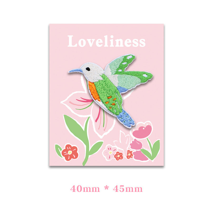 Self-adhesive hummingbird embroidered patch, green, 40 x 45 mm