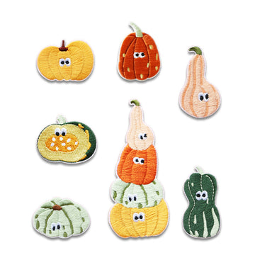 7 self-adhesive embroidered pumpkin patches with cartoon faces, assorted yellow, orange, green