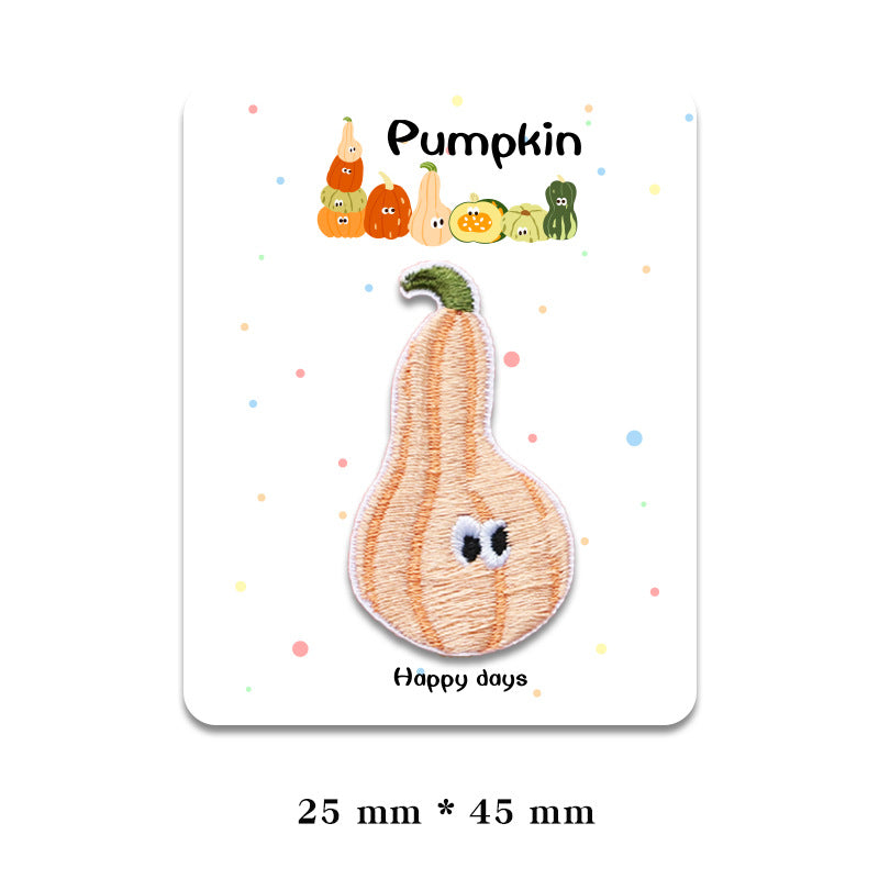 Peach pumpkin patch with green top and embroidered face