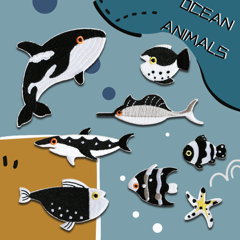 Ocean animal embroidered patch set featuring several fish and one seastar, self-adhesive