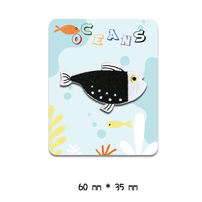 Black-and-white fish embroidered patch with yellow eye dot, 60 mm x 35 mm, self-adhesive