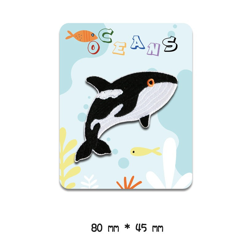 Black-and-white fish embroidered patch with orange eye dot, 80 mm x 45 mm, self-adhesive