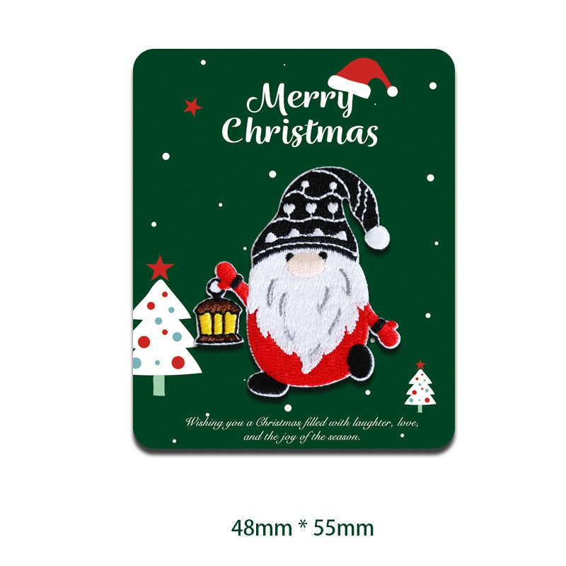 Weihnachts-Patch: Santa-Gesicht mit rotem Körper, schwarzem Hut mit Schneeflocken und Laterne