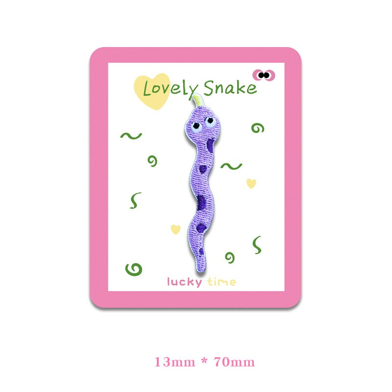 Purple snake embroidered cloth patch with dark spots and big eyes