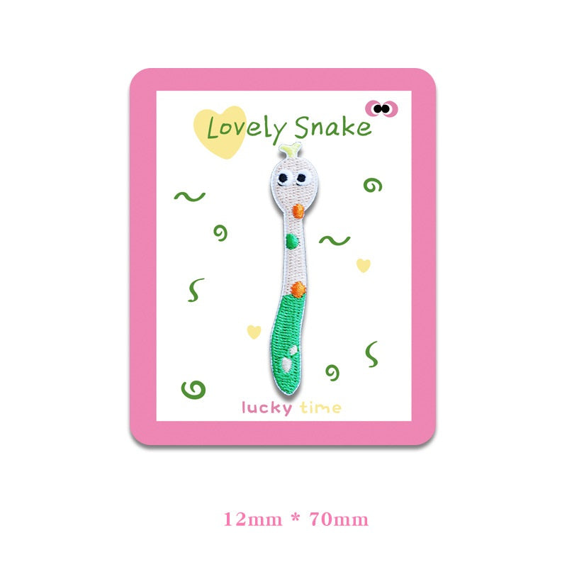 White-and-green snake embroidered cloth patch with orange and green spots