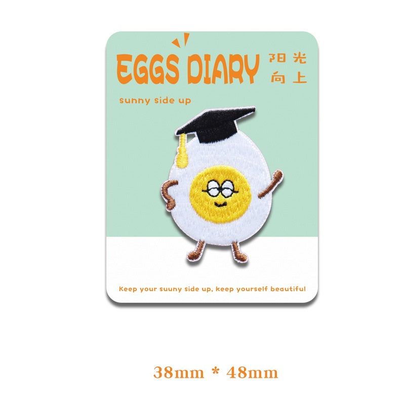 Graduation-cap fried egg embroidered patch with glasses and smiling face