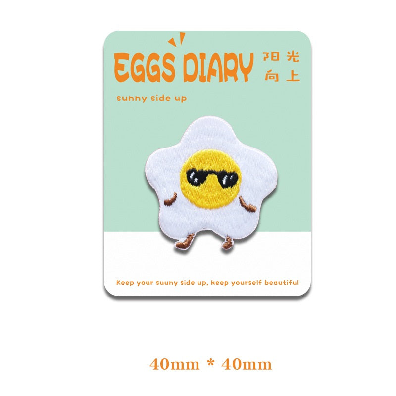 Embroidered fried egg patch with black sunglasses and smiling face