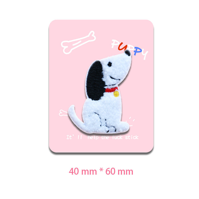 White dog patch, sitting pose, black ear spots, red collar with yellow tag