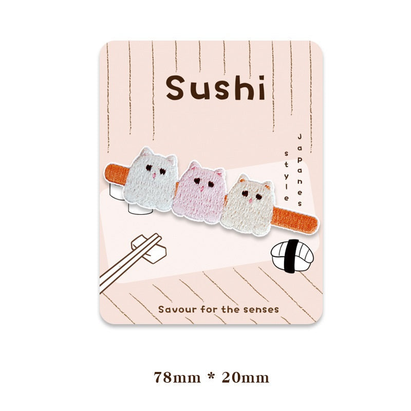 Cat trio sushi bar patch, three stitched faces on an orange strip with small ears