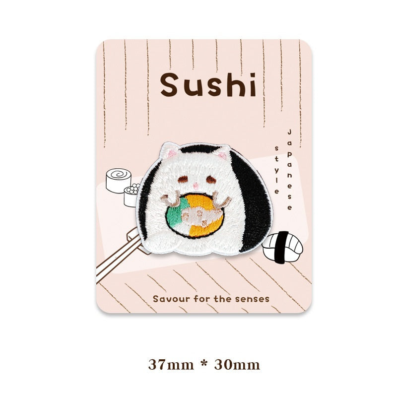 Panda sushi cat patch, white face with black ears and a green-blue filling in the center