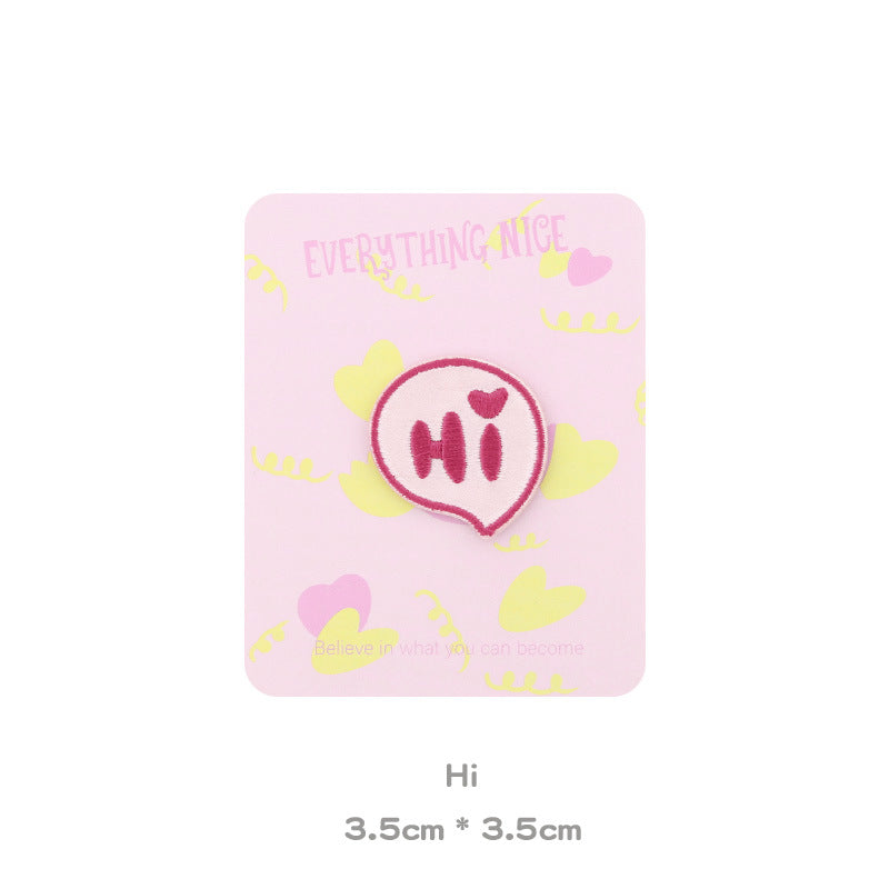 Pink embroidered “Hi” bear head patch, rounded face with heart accents on the muzzle