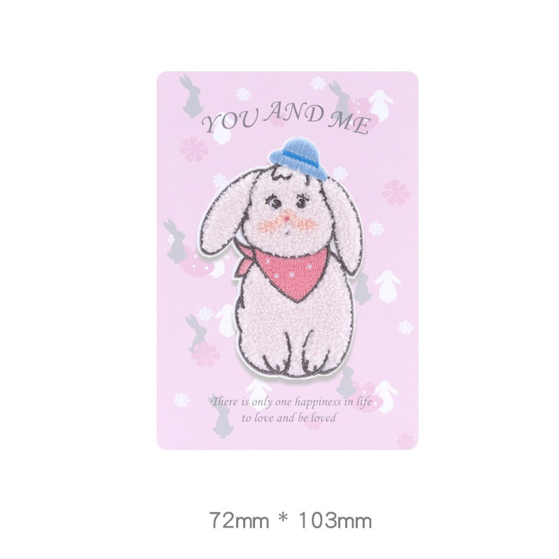 Embroidered self-adhesive white bunny towel patch with blue cap and pink bandana