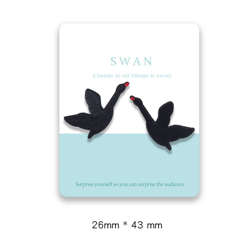 Carded swan adhesive patches: two black swans with red beaks, 26x43mm