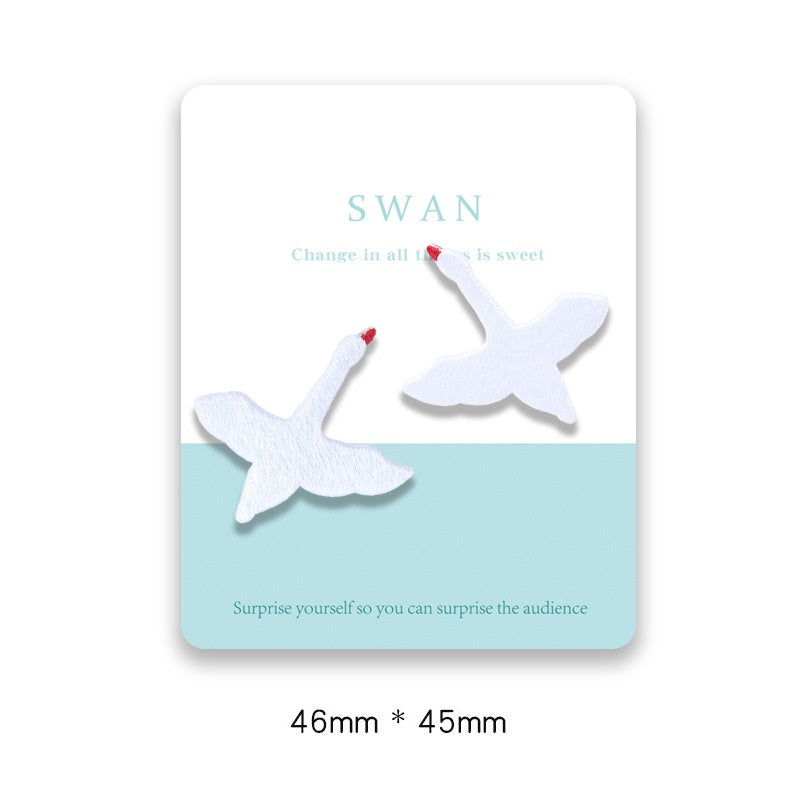 Carded swan adhesive patches: two white swans, 46x45mm