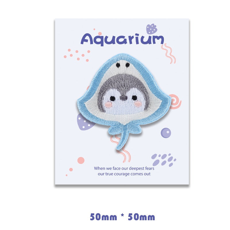 Light blue shark self-adhesive embroidered patch with gray face and pointed fin