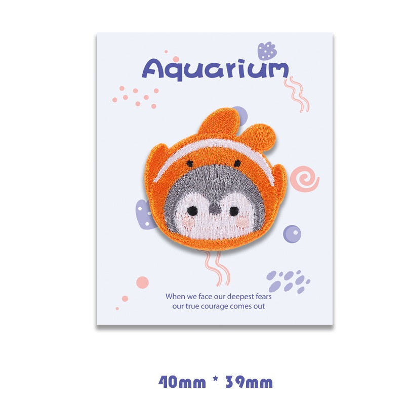 Orange clownfish self-adhesive embroidered patch with gray face and white markings