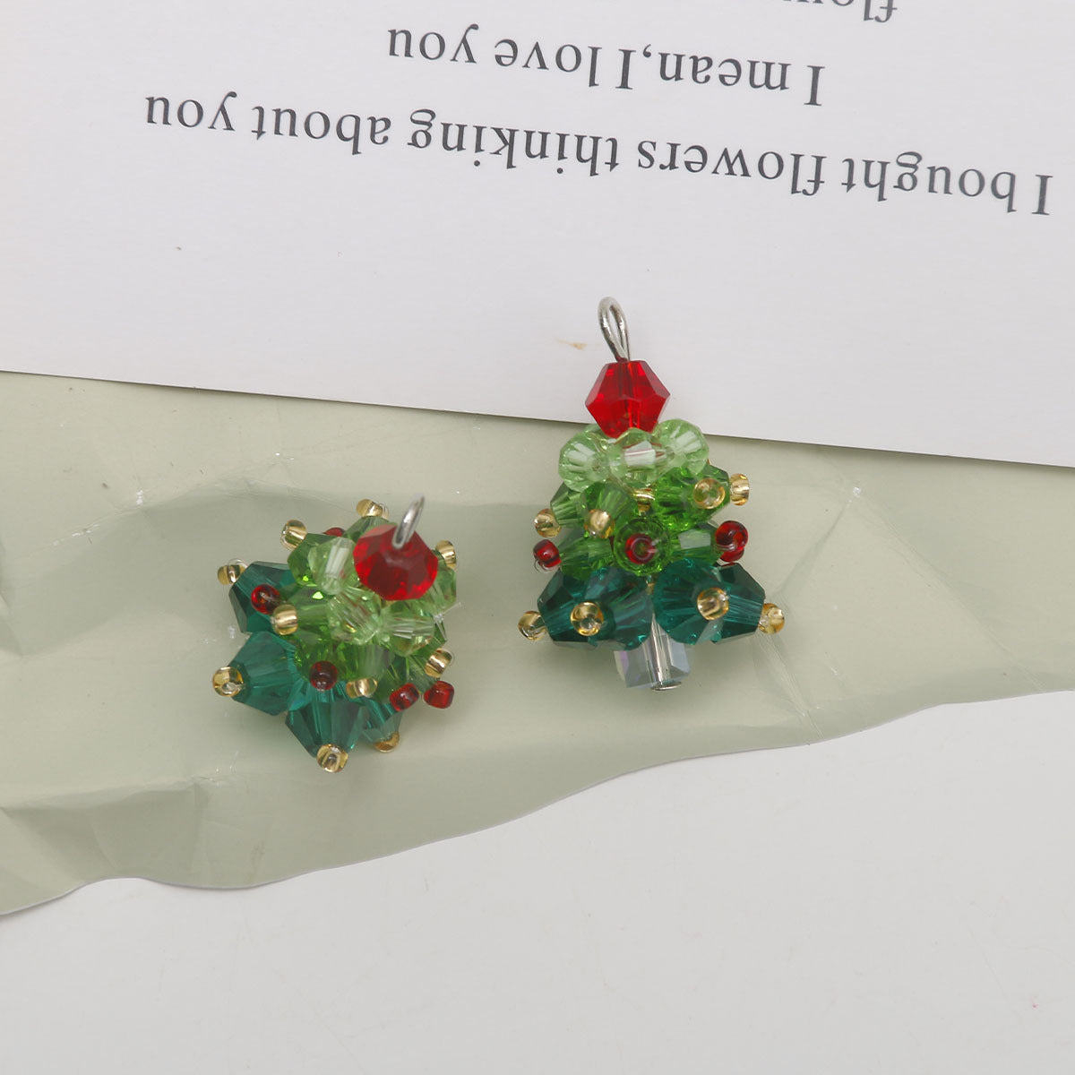 Colorful glass bead Christmas tree ornaments, red top, green-blue beads with gold-tone details